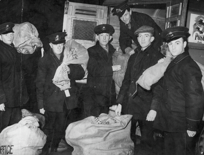 Postal  Workers loading Christmas mail