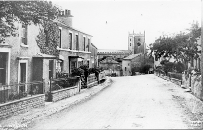 Main Street Warton with St Oswald's Church in background.