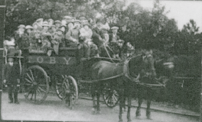 Horse drawn vehicle and passengers to Ormskirk Market