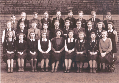 Miss Nora Pennington with form class, Chorley Grammar School.