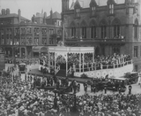 Visit of George V and Queen Mary: acknowledging cheers on the Town Hall steps, Market Place, Preston