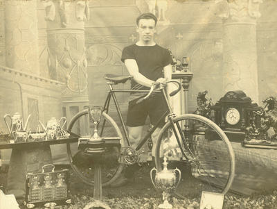 Cyclist J. W. Denton of Colne with trophies