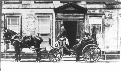 Horse and carriage outside main door at Clayton Hall