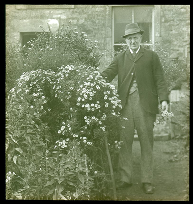 Lancaster - man in garden with flowers